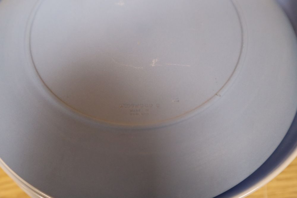 Sixteen Wedgwood jasper mother plates, ten Royal Copenhagen Christmas plates and twelve Limoges Paris view plates and a B & G plate